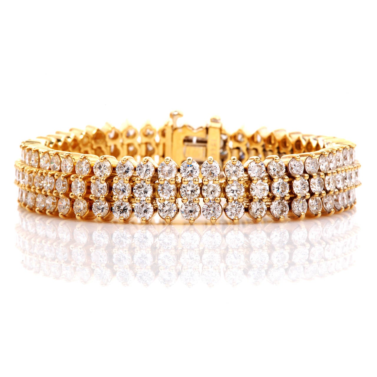 This stunning Jose Hess Diamond bracelet is finely crafted in solid 18K yellow gold. This bracelet is accented with some 144 genuine round cut diamonds approx 25.00ct, G color, VS1 clarity, prong set. With an security insert clasp, this flexible