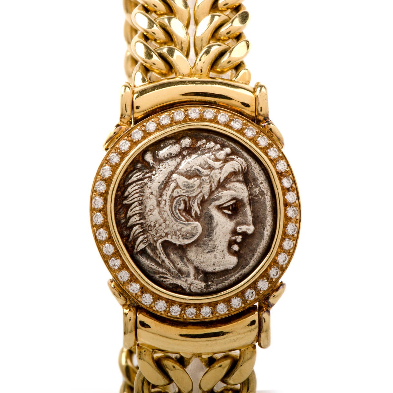 This stunning medallion coin bracelet is crafted in solid 18K gold. This heavy Cuban Gold Link Men bracelet is accented with some 71 genuine round cut diamonds approx 2.00carat, H color, VS1-VS2 clarity, prong set, while centered with an old Antique