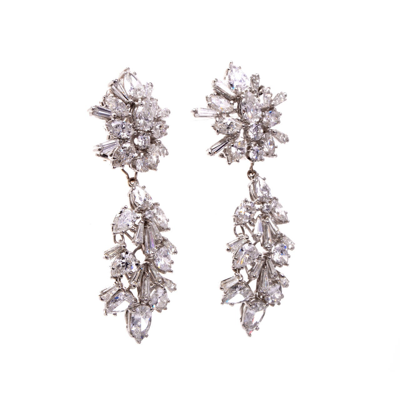 These antique circa 1960s earrings are a stunning combination of true magnificence, brilliance and pure luxury. These earrings are sure to be a breath-taking gift for your special someone or yourself, adding an unsurpassed opulence and shine to any