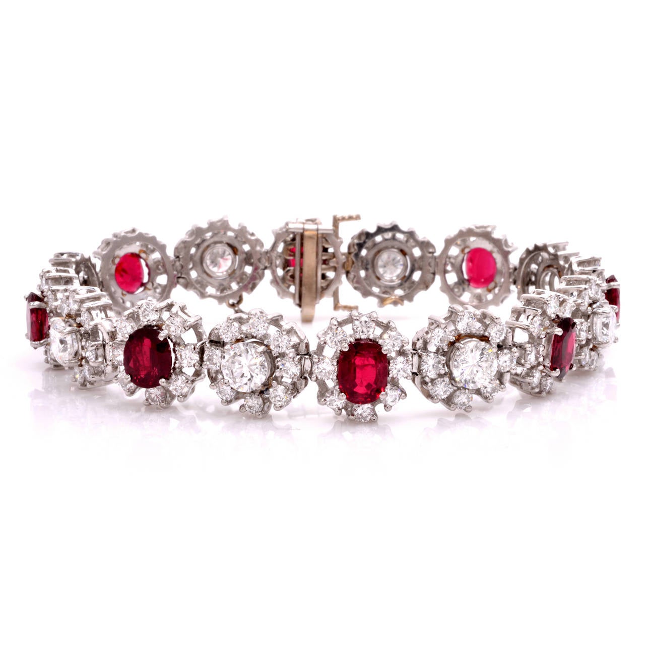 This sparkling and incredibly incandescent sophisticated diamond ruby bracelet radiates glamour with elegance. Finely crafted in solid 18K white gold, it is illuminated with a glittering combination of fine diamonds and genuine rubies in a floral
