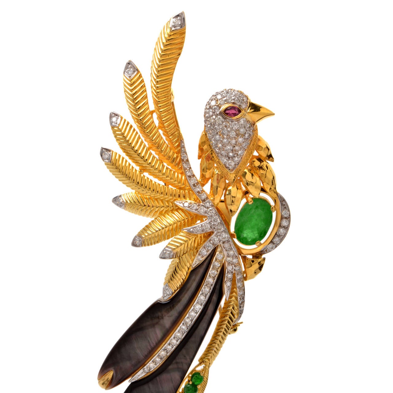 This absolutely stunning estate brooch pin is handcrafted in solid 18K yellow gold. Showcasing a large bird, where the eye is depicted by 1 genuine marquise  Ruby approx. 0.22 cttw, bezel set. The bird's body and tail are  represented with 1 genuine