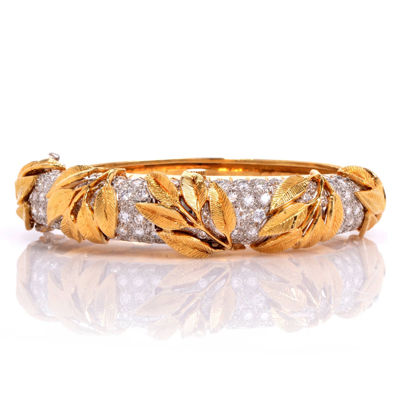 Shimmering with elegance and style, this watch bangle bracelet takes the idea of your jewelry being versatile to a new level! Finely crafted in solid 18K yellow gold and solid platinum. This bangle bracelet has gorgeous pave diamonds set in the