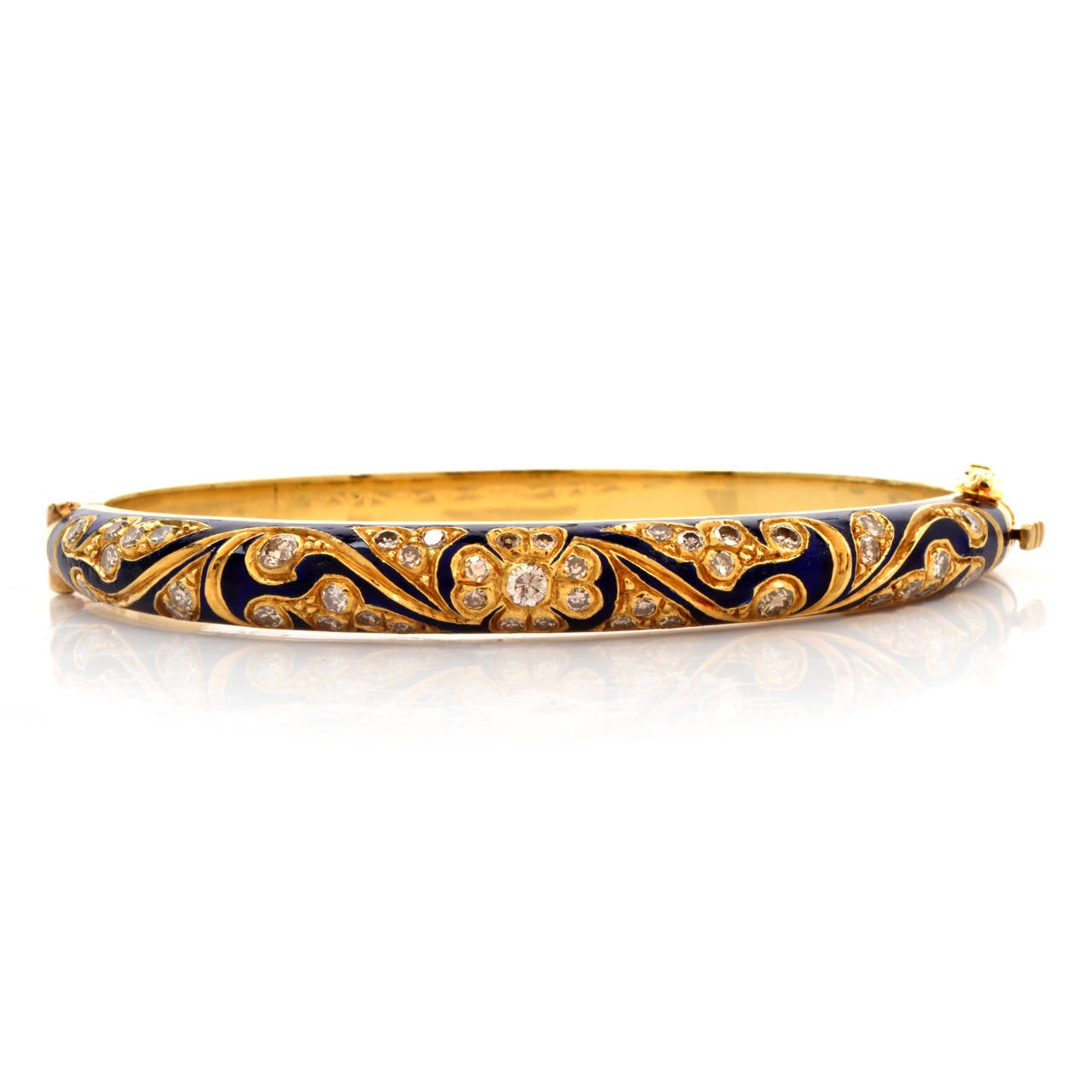 This bangle bracelet of absorbing aesthetic and Italian provenance is crafted in solid 18K yellow gold, weighing approximately 38.6 grams and measuring approx  7