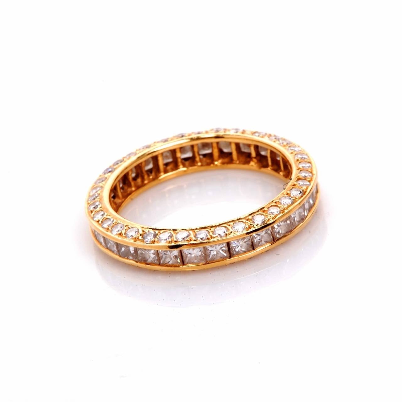 This beautiful elegant eternity band is finely crafted in solid 18K yellow gold. It is covered with 70 genuine round cut diamonds, and 30 genuine princess cut diamonds approx. 4.50 ct, H color, VS clarity, . This gorgeous band ring is in excellent