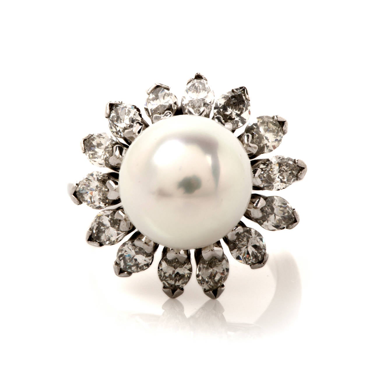 This lavish ring is full of elegant style and endless sparkle, a gorgeous statement making ring is finely crafted in solid 18K white gold, it features one genuine lustrous very high quality pearl approx. 11mm in diameter nestled among a sparkling