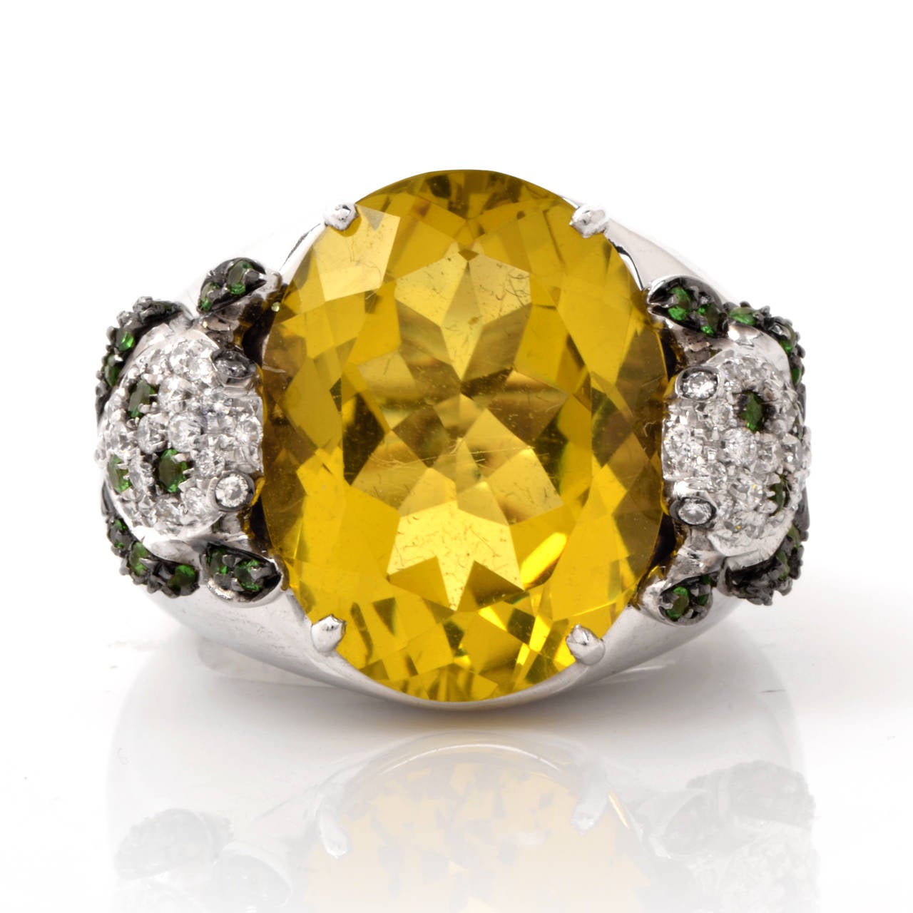 This  estate  Designer Valente Milano  cocktail ring is of Italian provenance, crafted in solid 18K white gold.  Vividly colored and classically elegant in aesthetic, this  alluring Italian ring is centered with an eye-catching   oval-faceted  lemon