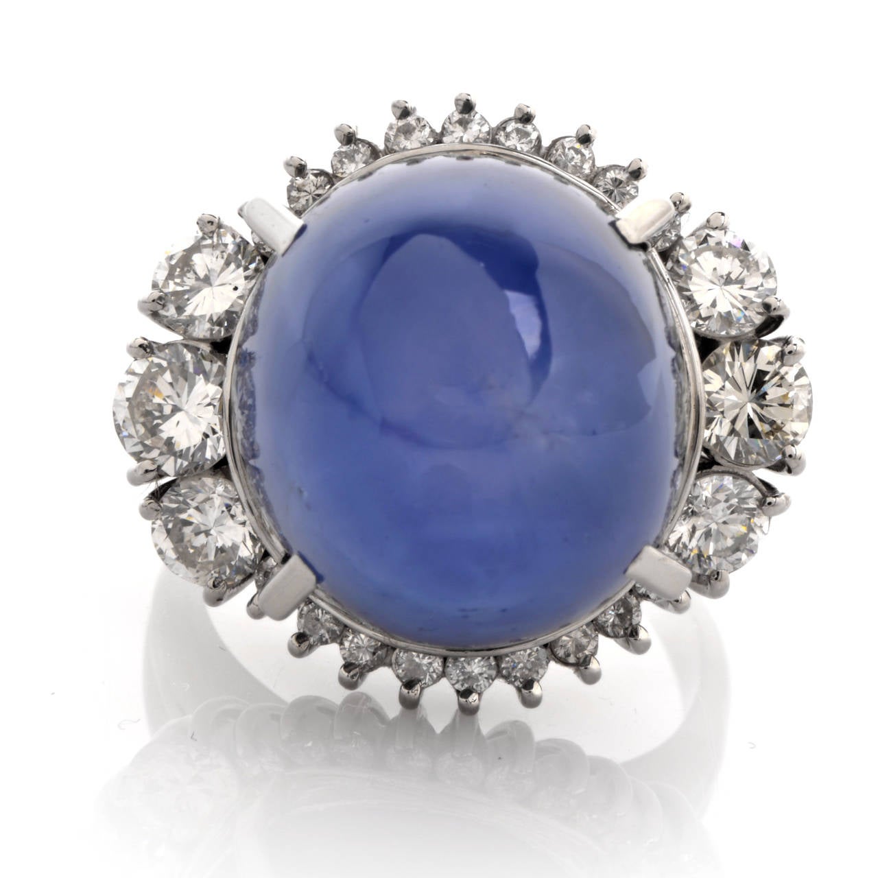 This captivating cocktail ring with a breath-taking genuine natural  No Heat star sapphire cabochon and genuine round-faceted diamonds is crafted in solid platinum and weighs approx. 18.4 grams. The fascinating star sapphire  cabochon of a