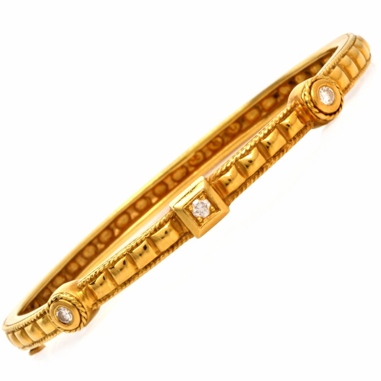 This 1930's bangle bracelet of refined aesthetic is crafted in solid 18K yellow gold, weighs 23.9 grams and measures approx. 6 1/4