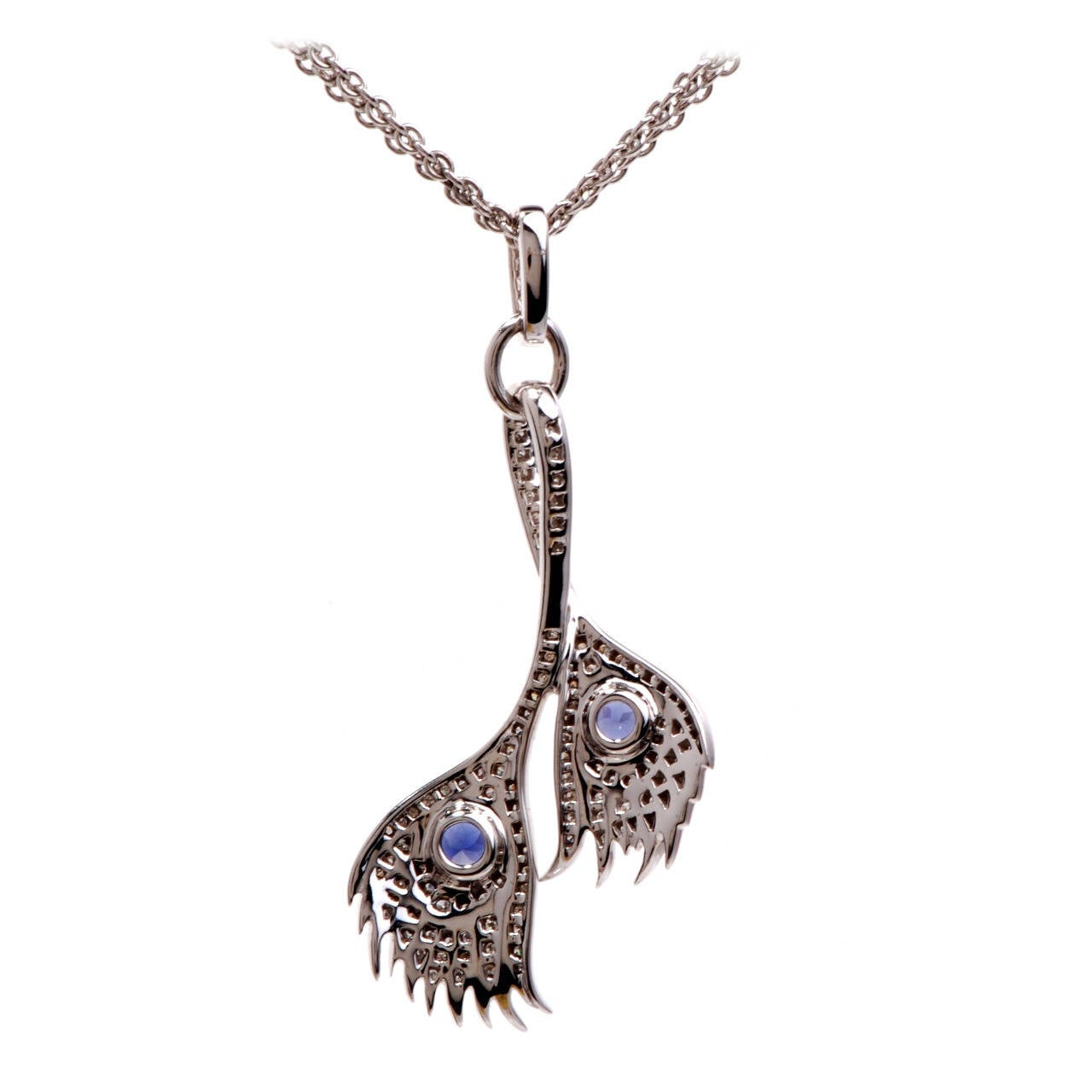 This lovely, 100% Original Carrera Carrera Peacock Pendant Necklace is crafted in solid 18K white gold. This pendant features a lovely peacock feather design with 2 genuine bezel set round tanzanite approx. 1.50 cttw and close to 100 beautifull