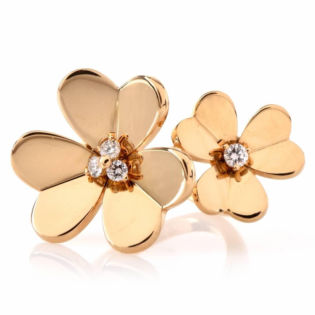 This Van Clef & Arpels ring of creative design and alluring floral motif is crafted in solid 18K yellow gold, designed as an open-end ring depicting a pair of botanically accurate, distinctly sized clovers. The enchanting 'symbols of good luck' for