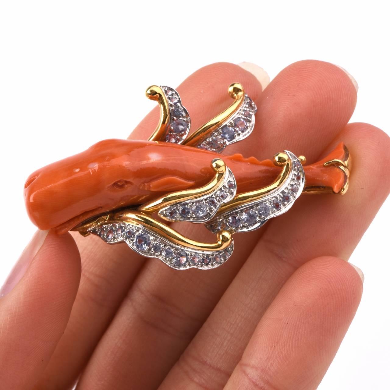 This elaborately detailed  vintage pin brooch from the Retro era is crafted in  a combination of solid  18K yellow and white gold, the latter applied to diamond settings. The pin simulates the sculptured body of a whale, meticulously carved in red