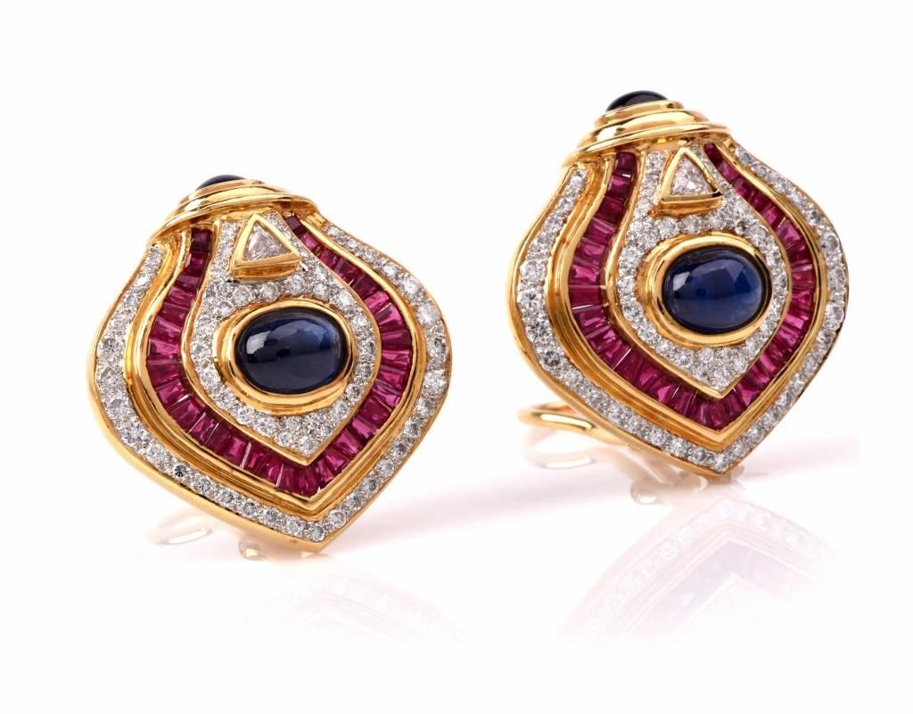 These beautiful estate diamond earrings crafted in solid 18K yellow gold. Showcasing a delicate and fancy design, these elegant earrings are centered with 64 genuine Baguette cut Rubies approx: 3.78 cttw, accented with 4 genuine Oval cabochon