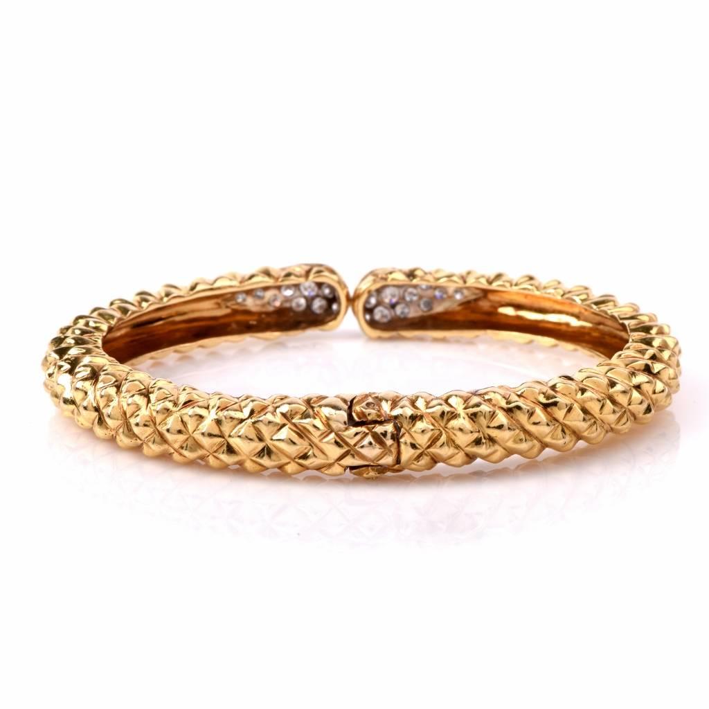 This  alluring cuff designer bangle bracelet crafted in solid d18K textured yellow gold, with a snake pattern to simulate snake's skin. It weighs 42.2 grams and measures approx. 7