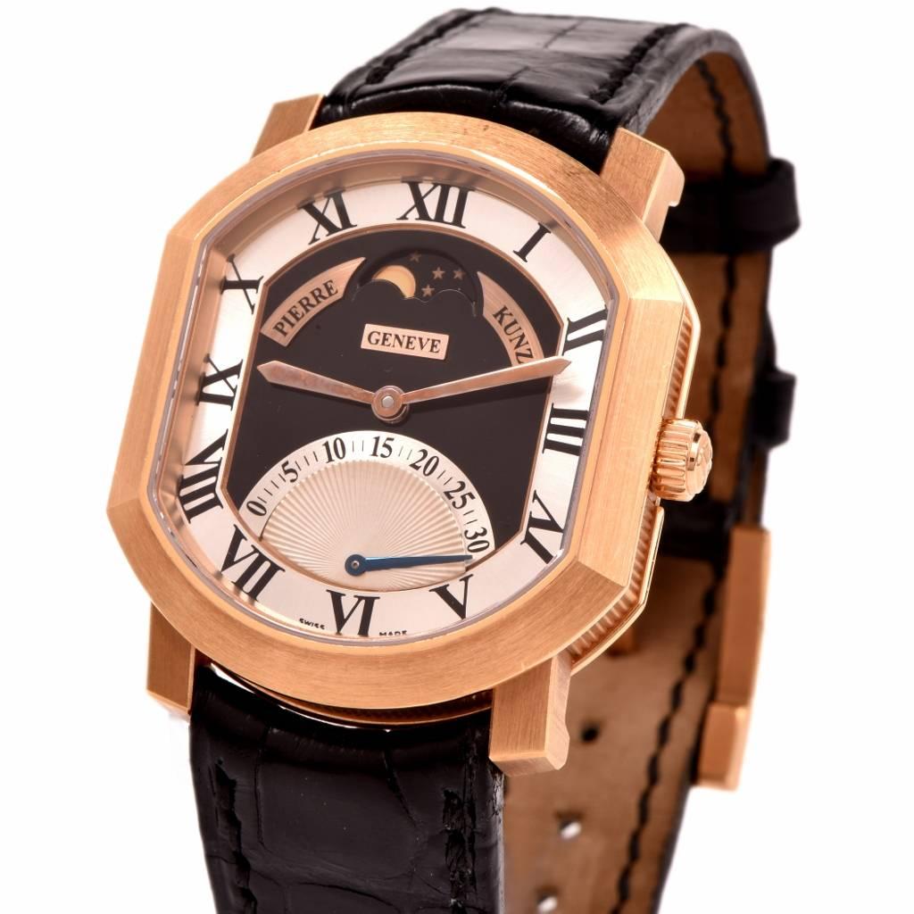 This Piere Kunz men's Swiss wristwatch ca 2005 is crafted in 18K rose gold case and rose gold buckle. Black and Silver dial with solid rose gold sword hands, black Roman numerals . The seconds function operates from 0 to 30 seconds and begins again