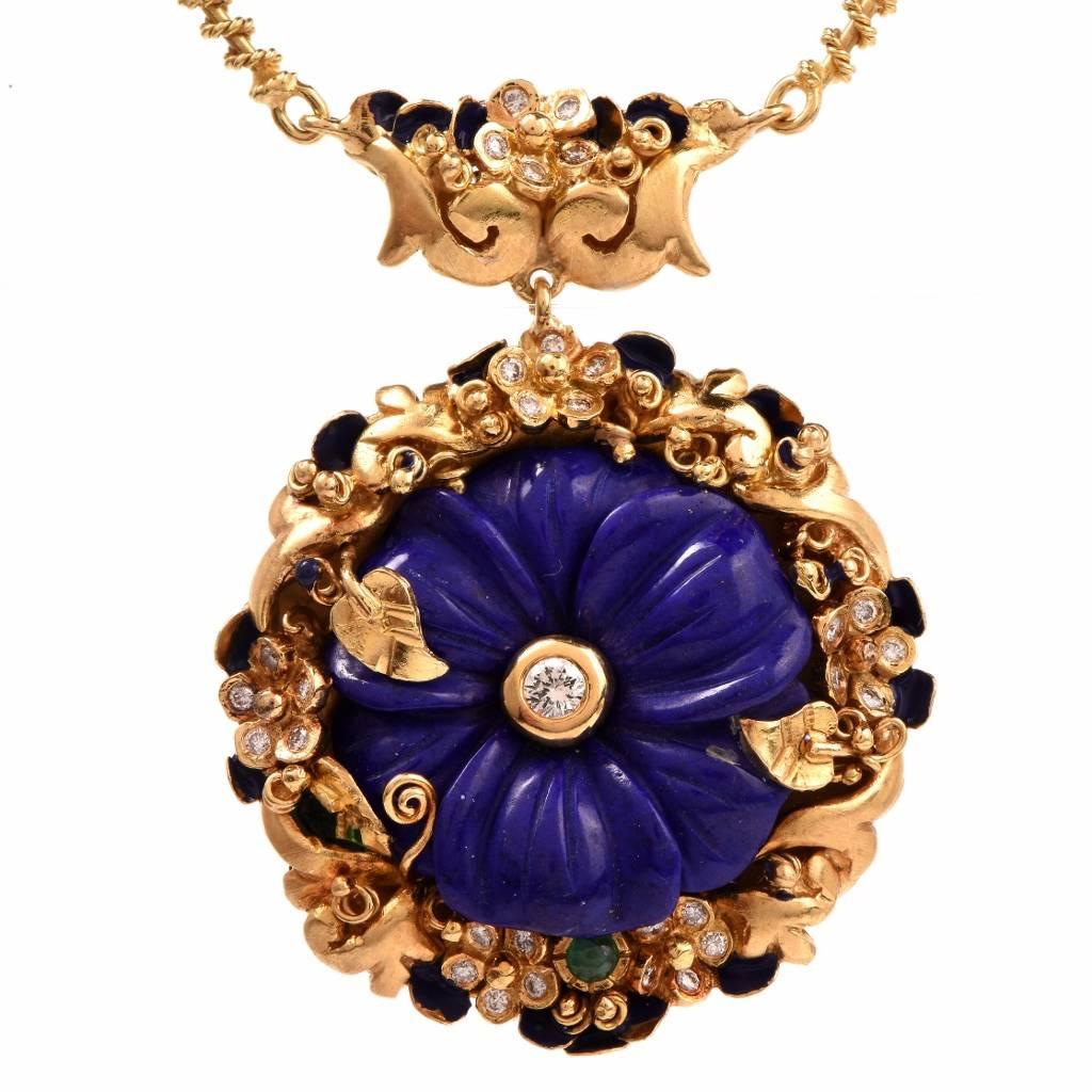 This vintage necklace of colorful aesthetic is crafted in 18K yellow gold and incorporates an immaculately handcrafted floral motif profiles. Centered with a bezel-set round-faceted diamond, the pendant is adorned with artfully carved lapis lazuli