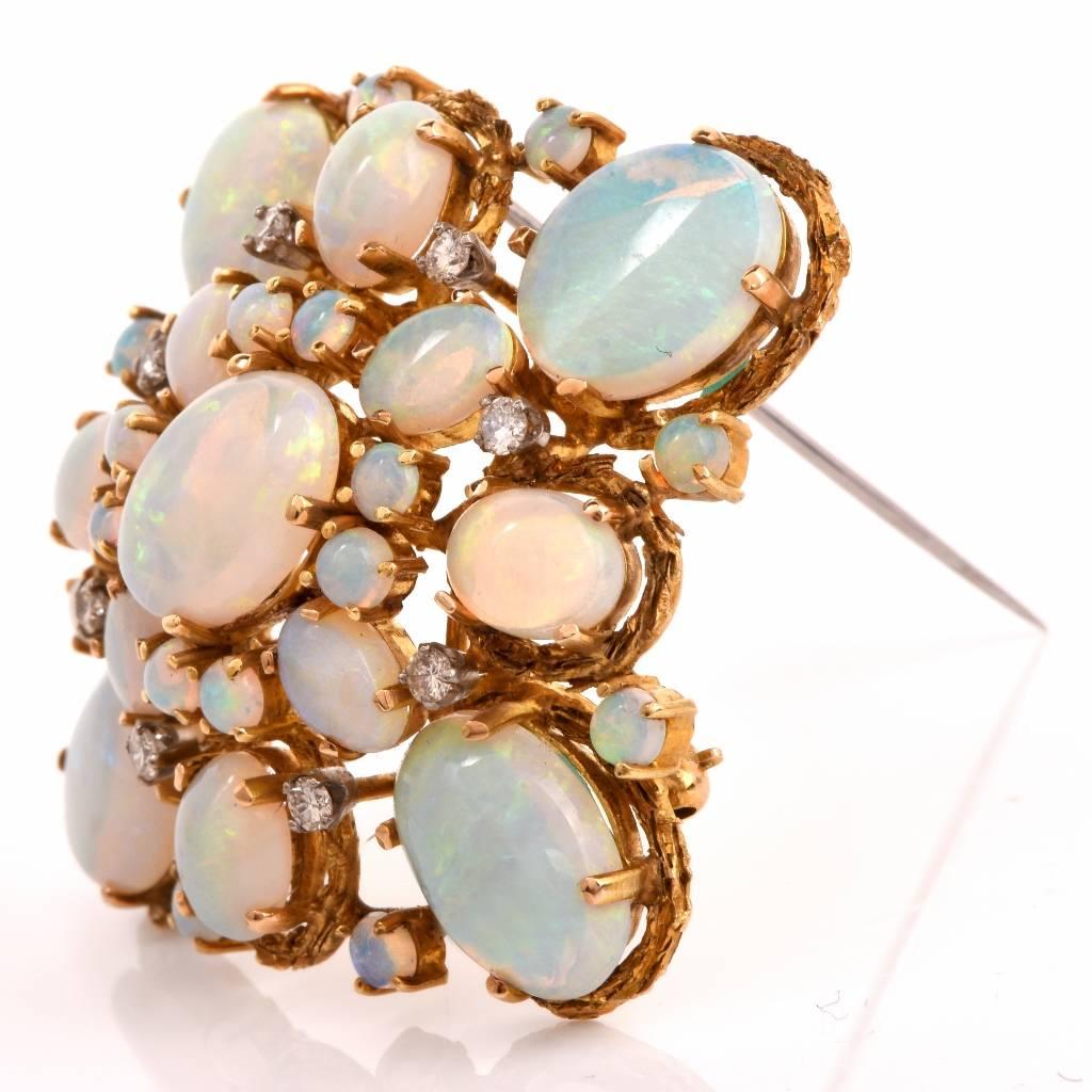 This captivating vintage retro pin brooch is crafted in solid 14K yellow gold, weighing 20 grams and measuring 48 mm long and 46 mm wide. This Retro 5 large  brooch is adorned with 13 distinctly sized opal cabochons, 16 round opal cabochons, approx.