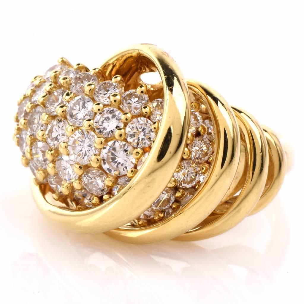 This captivating Jose Hess cocktail ring of impressive aesthetic is crafted in solid 18K yellow gold. Designed as a stylized dome shaped plaque with some 46 genuine round-faceted diamonds approx. 2.53cts graded H-I color and VS1-VS2 clarity. This