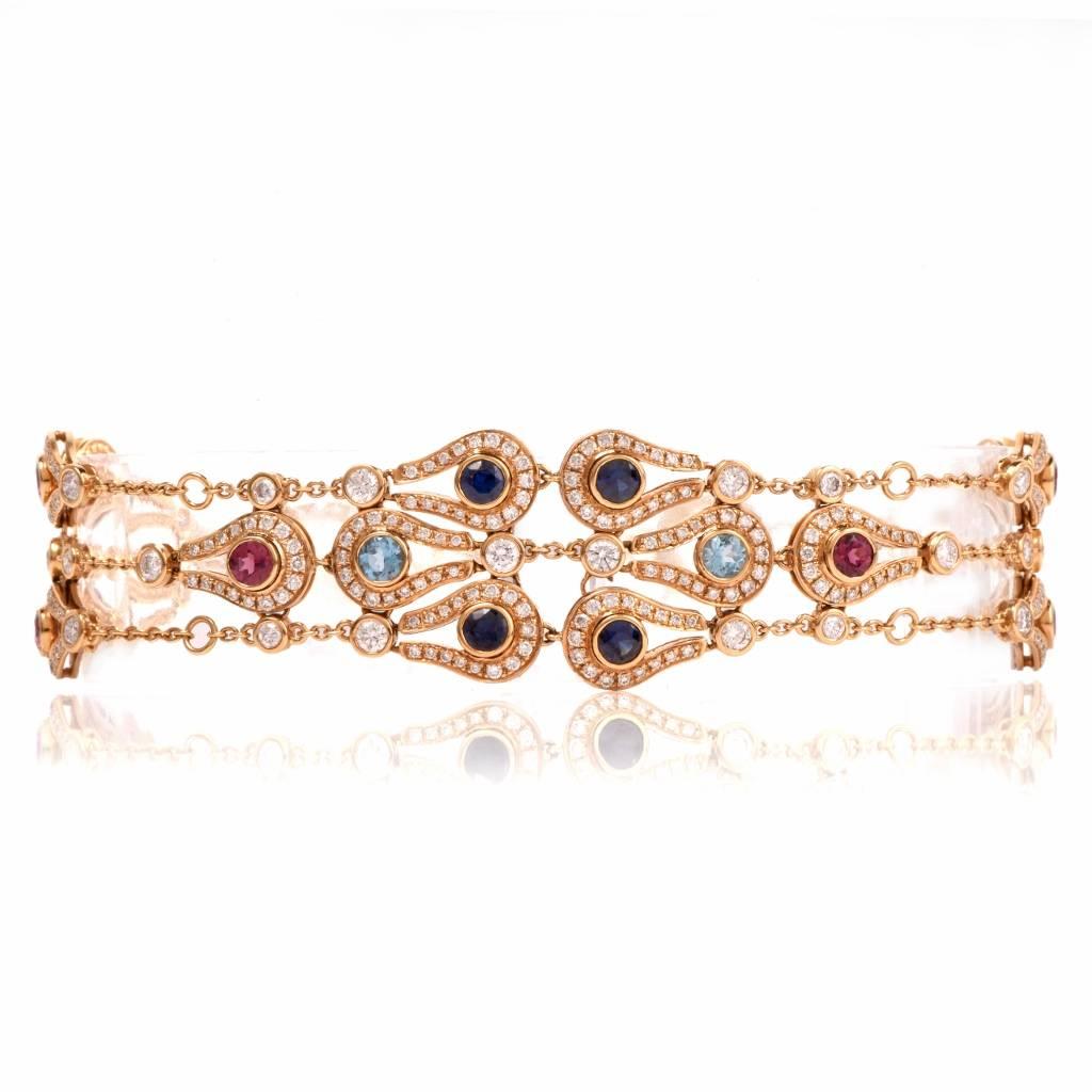 This finely designer Di MODOLO multi-gem link bracelet from “Fiamma” collection is crafted in 18K gold. It is incorporates with 16 pear-shaped profiles set with blue sapphires, Chocolate, Garnet, Pink Sapphire, Blue Topaz, pink tourmaline all