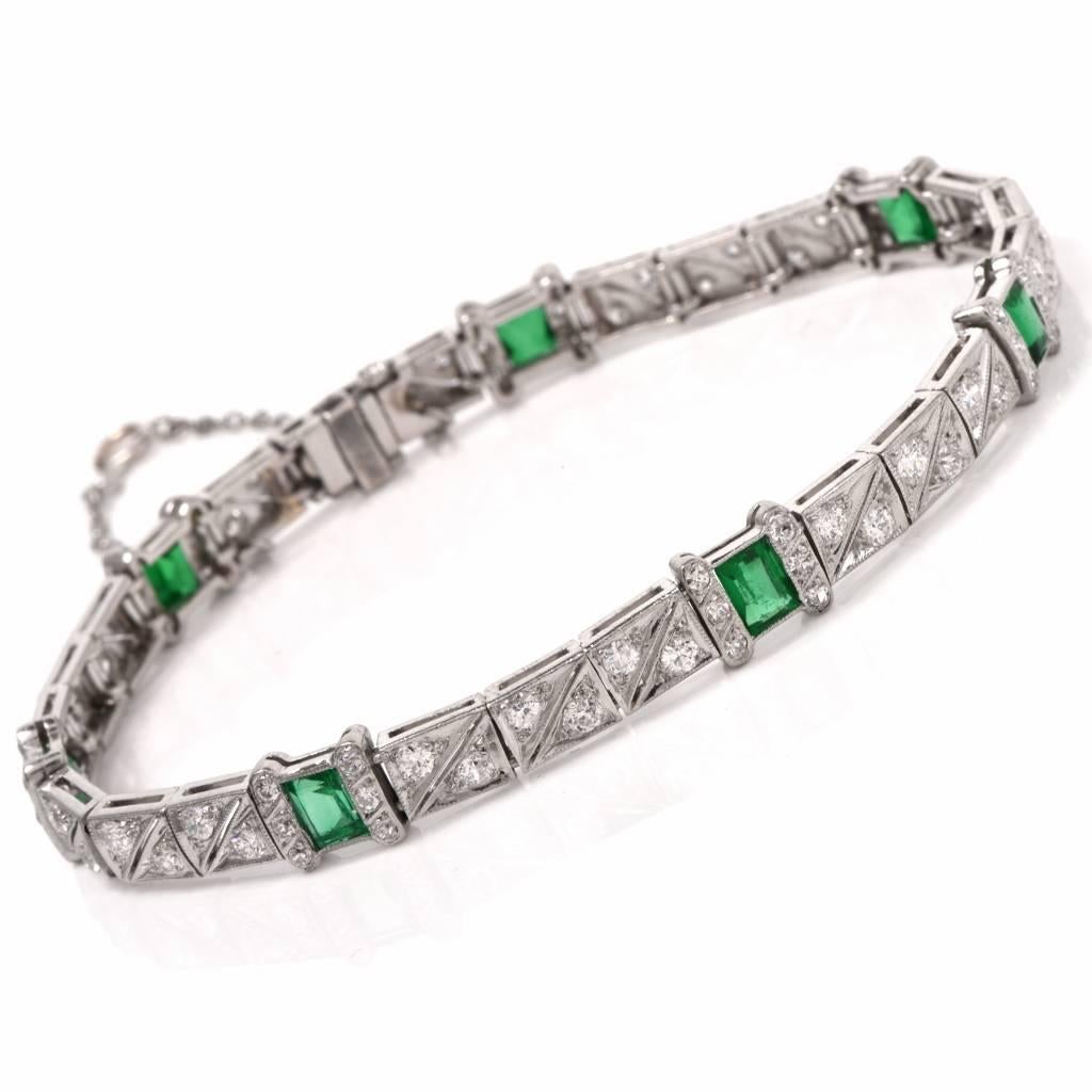 This captivating antique bracelet is crafted in solid platinum. This Art Deco bracelet with geometric details, features 28  flexible rectangular links set with 7 genuine emerald-cut emeralds weighing cumulatively cts 2.70cts  and adorned with
