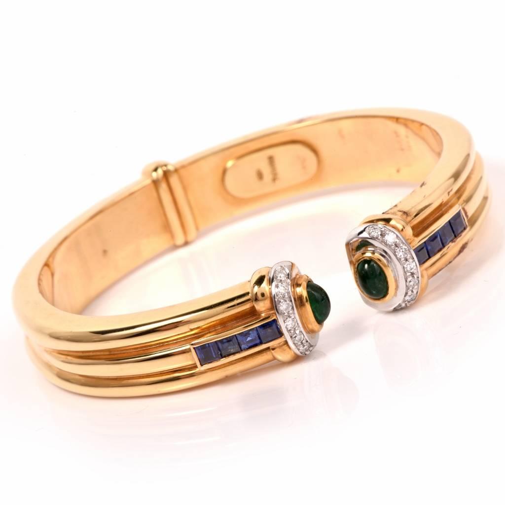 This alluring estate cuff bracelet circa 1980's is crafted in solid 18K  high polished yellow gold. The bracelet is enriched with two emerald oval cabochons at both open ends approx. 0.85cts, 14 pave round diamond approx. 0.20cts, G-H color, VS1-VS2