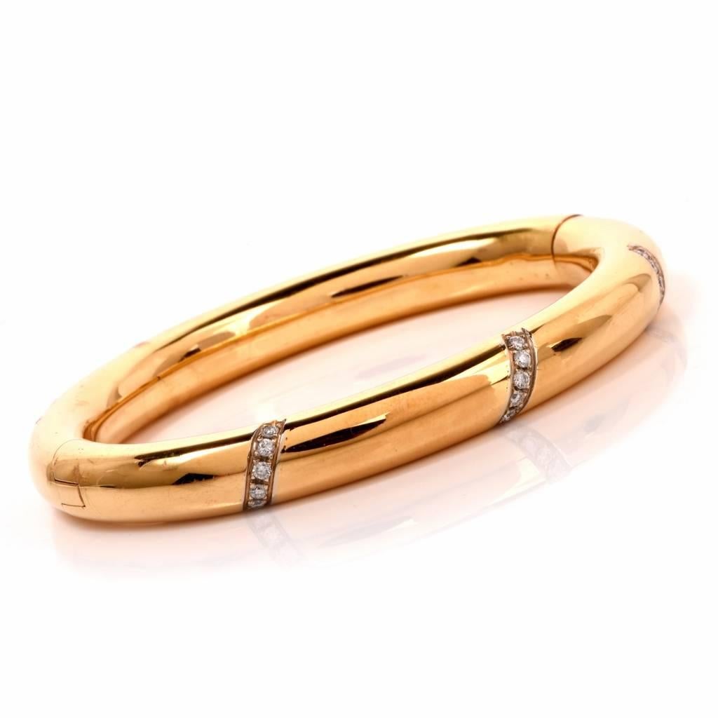 This fashionable bangle bracelet is crafted in 18K yellow gold. This finely high polished yellow gold bangle is beautifully adorned with 15 genuine round-cut diamonds 0.40ct, H-I color and VS1-VS2 clarity, pave-set, and remains in excellent