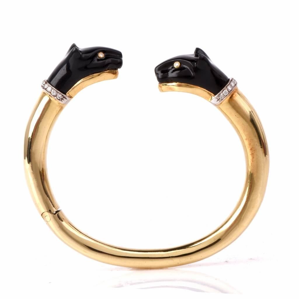 This bangle bracelet crafted in solid 18K yellow gold, Showcasing two beautifully carved Panther one in onyx and the orther in Black coral. It embellished with 26 genuine round cut diamonds approx: 0.30cttw, H-I color, VS1-VS2 clarity in prong and