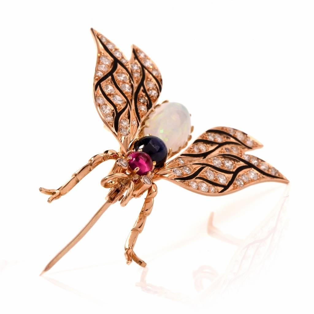 This colorful bee pin brooch f is crafted in solid 18K gold. The wings are adorned with 56 round-faceted diamonds and the eyes with 2 diamonds, cumulatively weighing 1.27cts, graded H-I color and VS2-SI1 clarity. The diamonds are positioned within