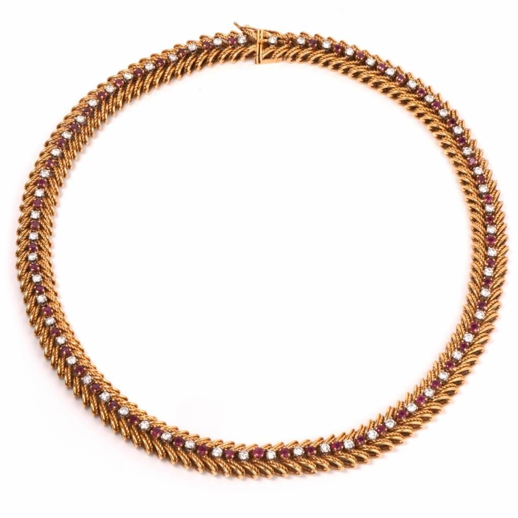 This stunning Retro necklace circa 1950's is crafted in 18k yellow gold with 60 round-faceted diamonds and 58 round rubies, masterfully set on intertwined links simulating herringbone pattern. The diamonds weigh cumulatively 4.74cts, graded H-I