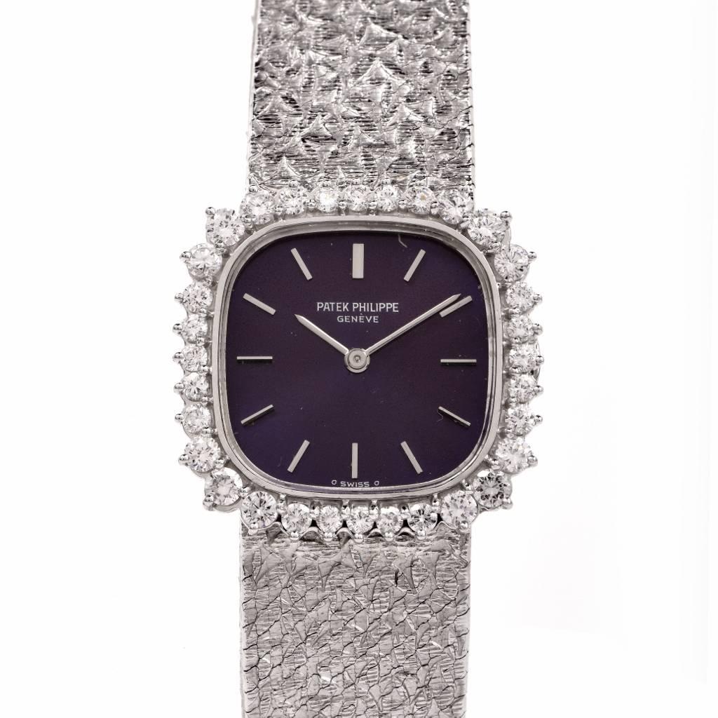 This exquisite all original Patek Philippe Ellipse ladies watch is crafted in 18k white gold. The case presents an attractive royal blue dial embraced by 32 Factory set round brilliant cut diamonds approx. 1.25cttw, F-G color, VVS1-VVS2 clarity. The