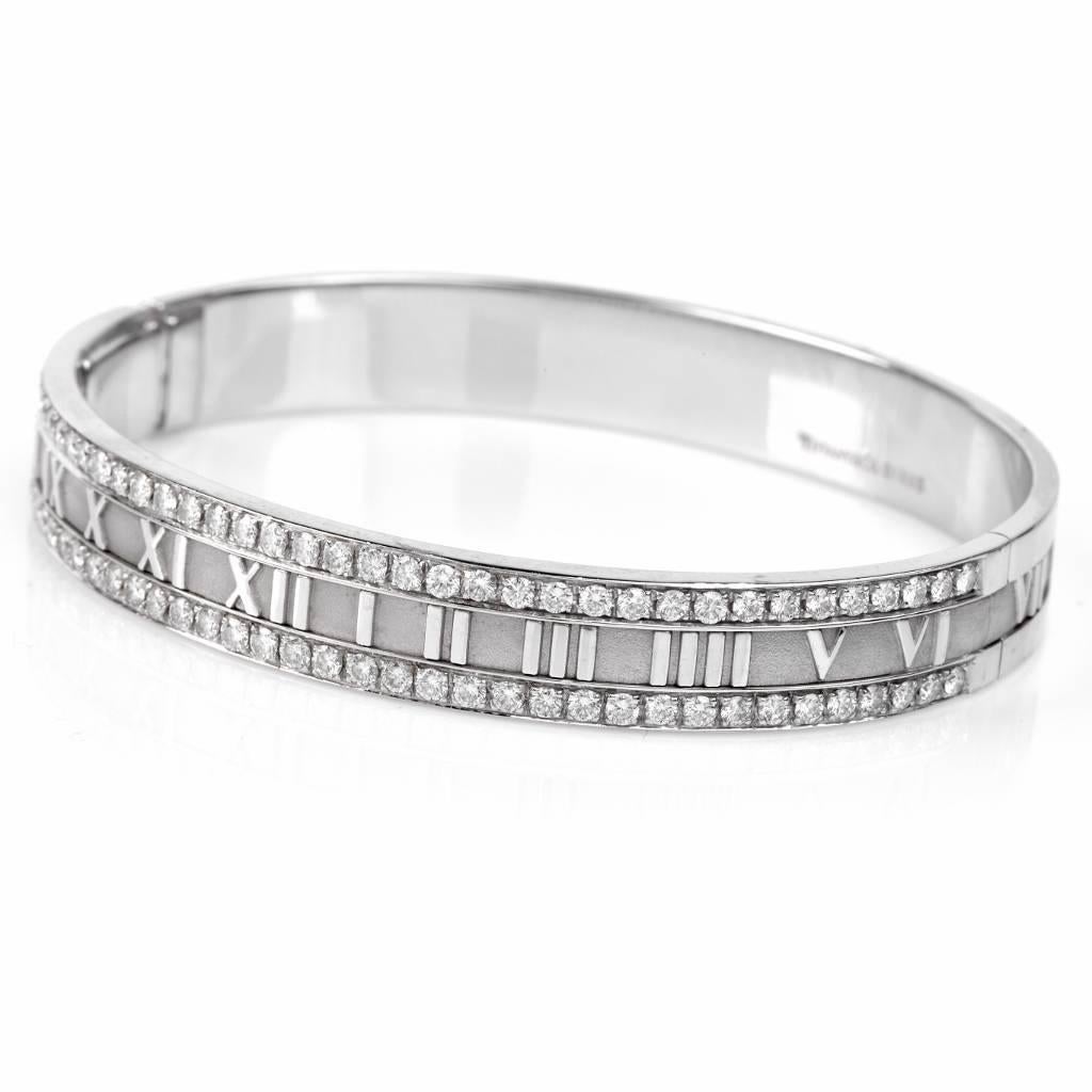This timeless classic piece from Tiffany & Co. 'Atlas' collection is crafted in 18K white gold and exposes roman numerals all around, adorned with some 82 round cut genuine Tiffany diamonds of approx. 2.46cttw, graded F-G color, VVS1-VVS2 clarity.
