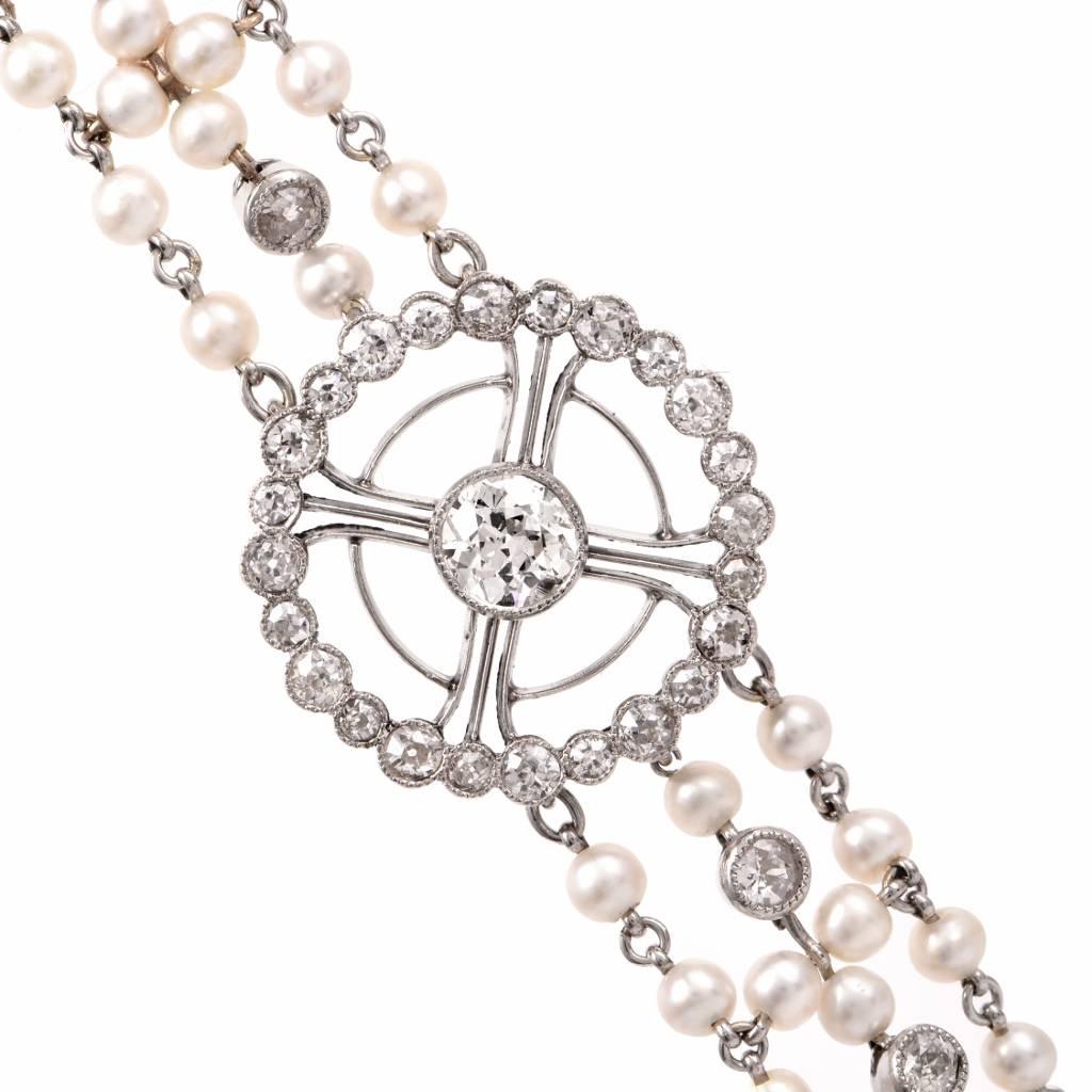This alluringly refined antique bracelet is rendered in solid platinum, comprising three parallel strands of well-matched lustrous seed pearls measuring approx. 3 mm in diameter, of an enchanting white color. The genuine seed pearls are intersected