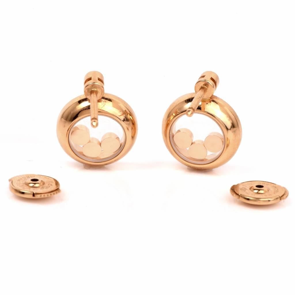 These elegant Chopard diamond earrings from the ' Happy Diamonds ' Collection are crafted in solid 18K yellow gold and weigh 7.1 grams. These earrings are adorned with 6 floating round cut genuine diamonds and 56 diamonds, all weighing approx.