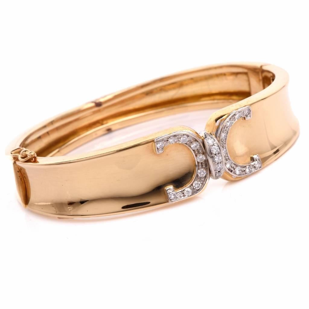 This estate bangle bracelet of classic elegance is crafted in solid 18K polished yellow gold, weighing 31.6 grams and measuring 6.3/4