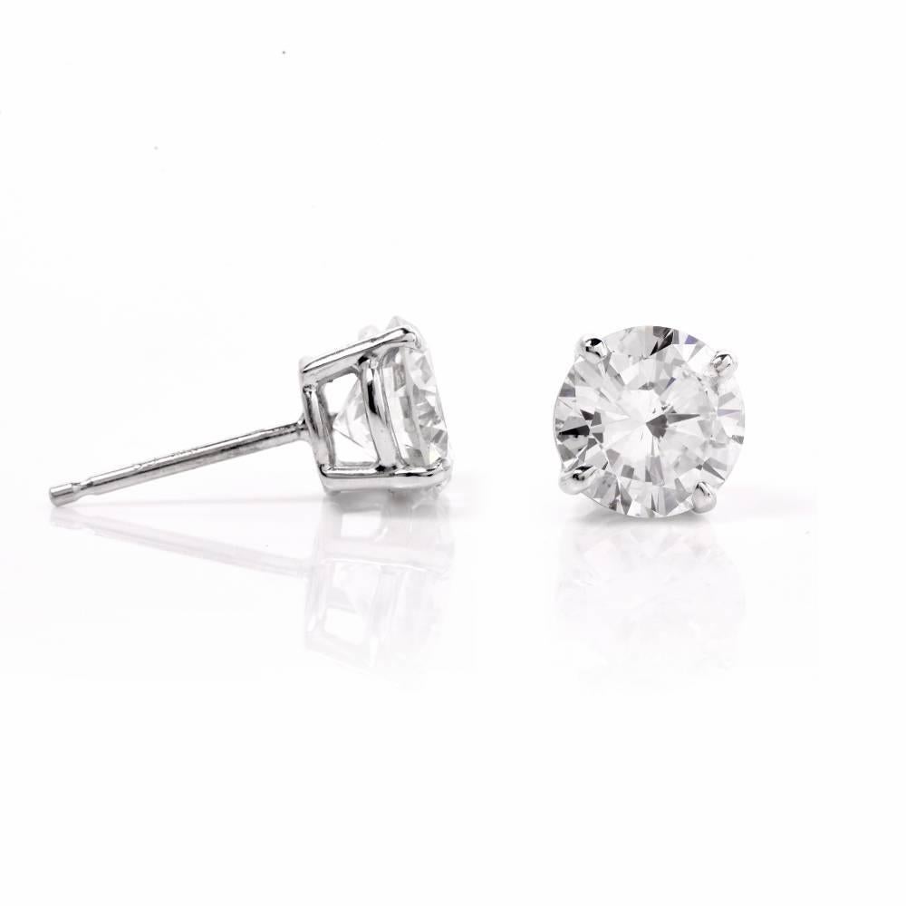 These sparking Certified diamond stud earrings are crafted in solid 18K white gold, weighing approx. 1.5 grams and measuring 7.2  mm in diameter. These stunning earrings expose two brilliant-cut diamonds weighing approx. 2.13 ct in total. One