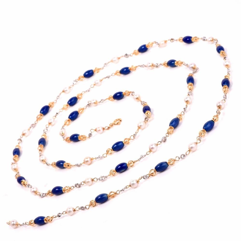 This stylish long necklace from the renowned Designer ‘UNOAERRE’ is crafted in solid 18K yellow gold and incorporates 27 pearls approx. 5mm, adorned by 52 oval Italian blue enamel beads and enhanced by some 52 round cut sparkling diamonds, weighing