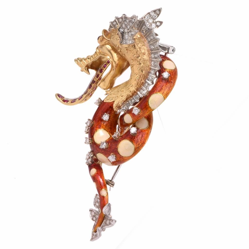 This mythical Chinese dragon brooch pin is crafted in solid 18K yellow and white gold. The dragon is adorned with 101 genuine round cut diamonds approx. 1.83cts, color, clarity while the artfully coiled body is covered by glazed orangish red and off