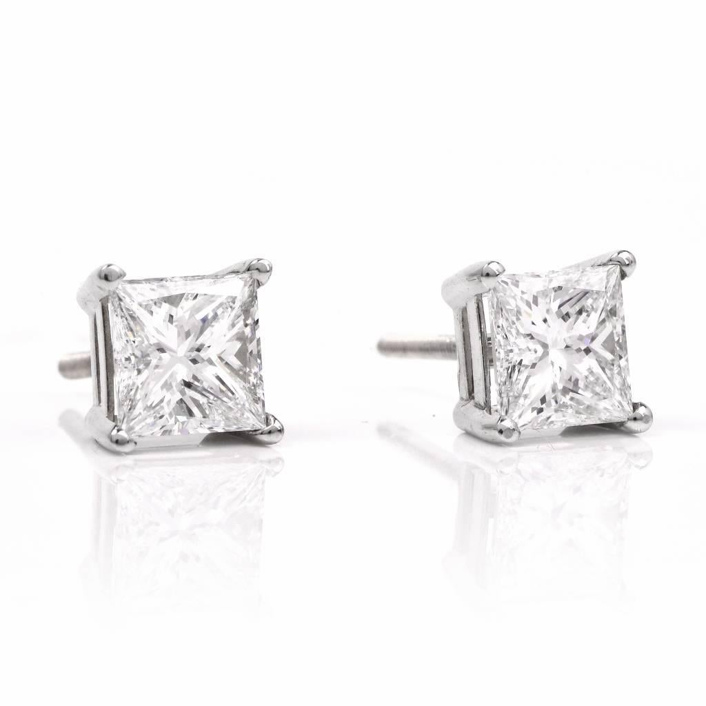 These exquisite diamond stud earrings are crafted in solid 18k white gold.  Set with two stunning princess-cut diamonds, both diamonds are having same weight, color and clarity. They are GIA certified, E c0l0r, VS1 weighing each 1.04cts with total