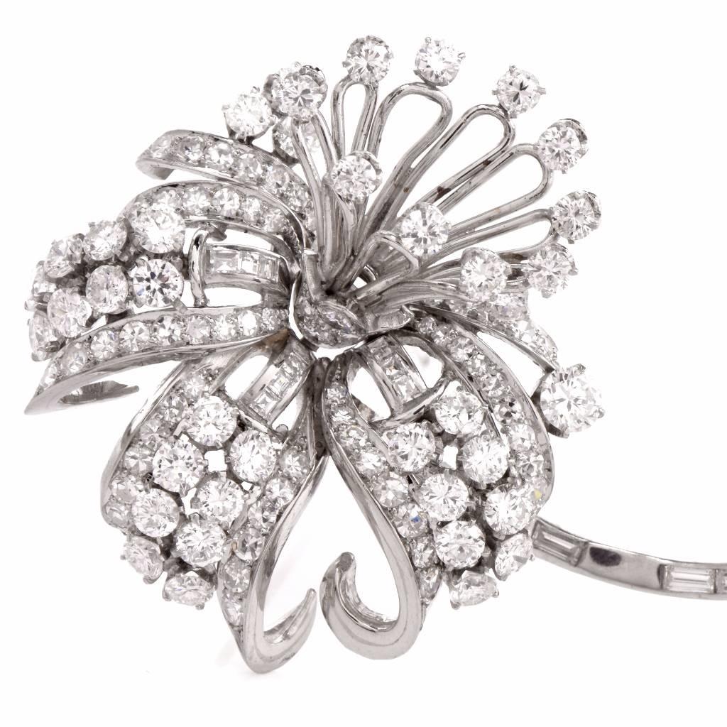 This charming Antique brooch pin circa 1950’s is crafted in solid Platinum. Featuring a gorgeous flower with leaf covered with approx. 112 genuine round cut vibrant diamonds approx: 6.70cttw, G-H color, VS1-VS2 clarity, prong set and approx. 15