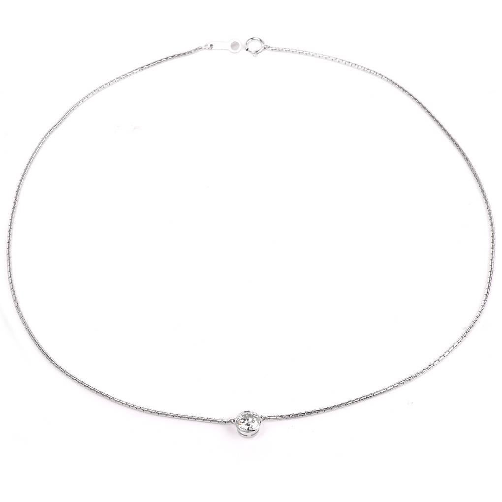 This classic diamond pendant is crafted in solid platinum. The necklace exposes 1 GIA certified genuine round brilliant cut diamond of approx: 0.77 carats,  F Color, VVS2 Clarity,  Bezel set . This item features a charming chain with a secure