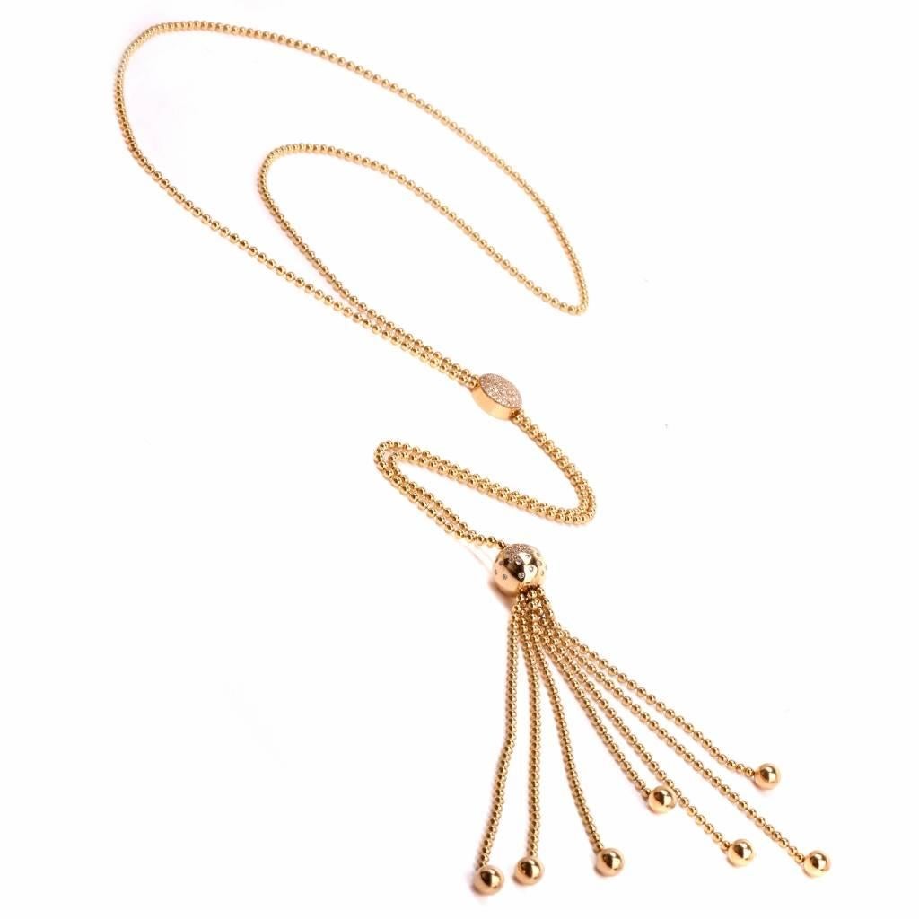 Dover Jewelry presents this eye catching diamond necklace by designer Cartier crafted in solid 18K yellow gold from the " Draperie " Collection.

The fashionable designer lariat necklace showcases an exquisite tassel design with dangling