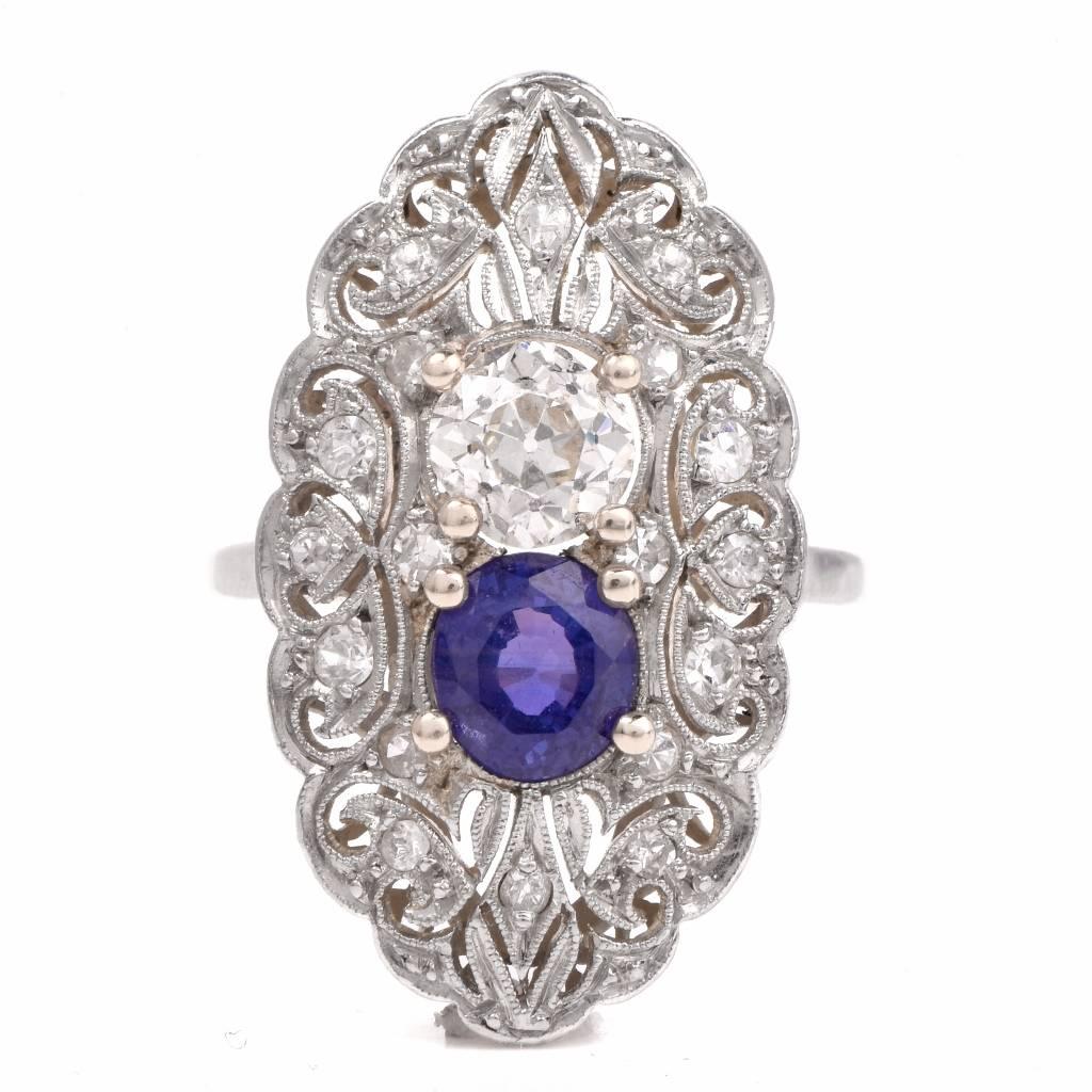 Showcasing a classic design embellish with 1 genuine Old Cut Diamond approx: 0.73cttw, H-I color, VS1-VS2 clarity, prong set and 1 genuine Round cut Purple Sapphire approx: 0.90cttw, and adorned with 16 genuine Round cut Diamonds approx: 0.20cttw,