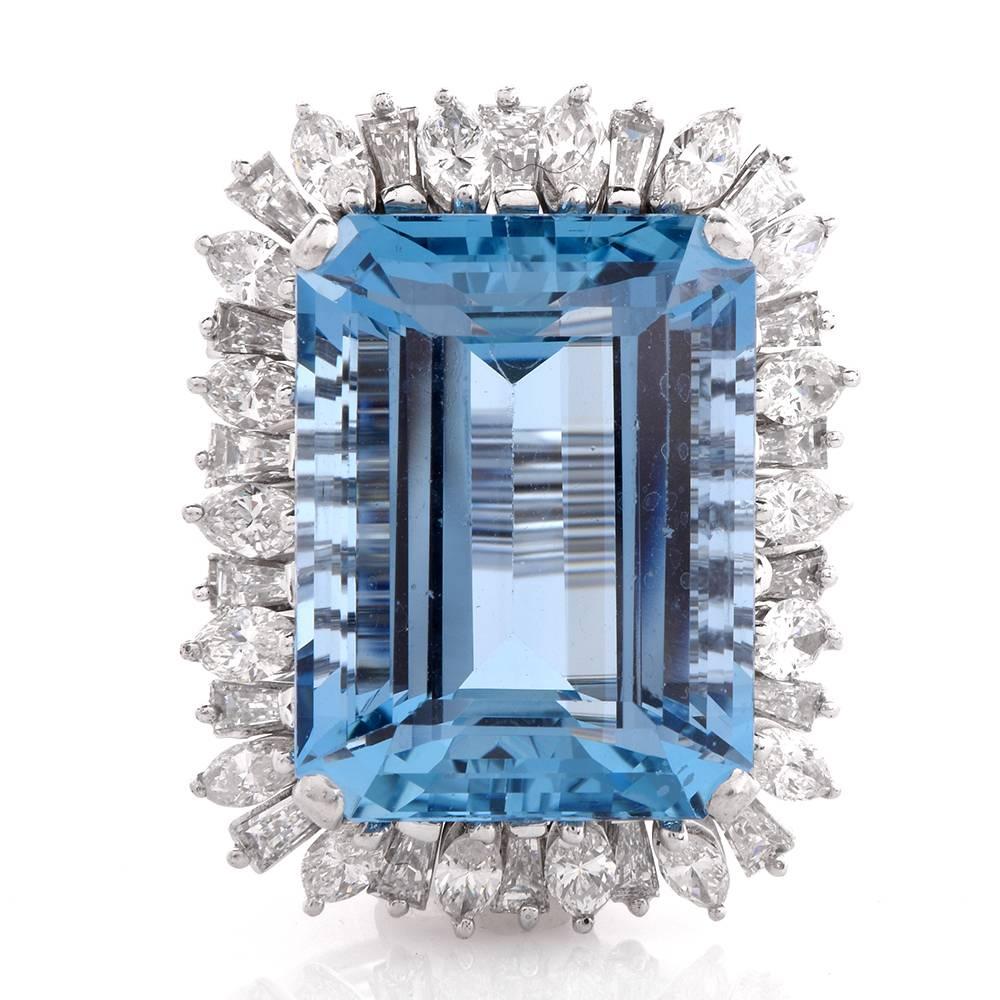 This stunning Santa Maria Aquamarine Diamond Cocktail ring is hand crafted in solid 18K white gold weighing approx. 17.1 grams and measuring 31mm by 24mm, 12mm high. The center exposes a emerald cut genuine flawless Aquamarine Gem approx: 27.36cttw,