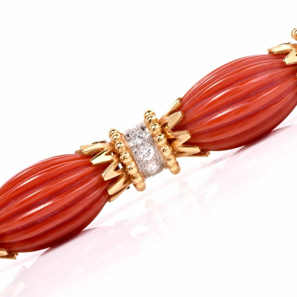 This elegant Van Cleef & Arpels bracelet was crafted during the mid 1970’s in France. This VCA collectable bracelet is embellished with 6 genuine carved Red Coral links. This links are encrusted with 18 genuine round cut sparkling Diamonds