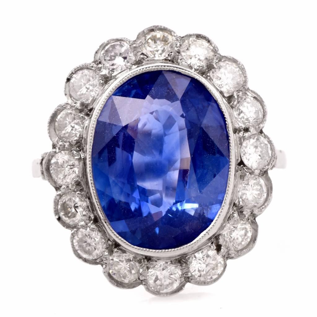 This classic Vintage Sapphire ring is crafted in solid platinum. Centered with a GIA certified oval cut natural corundum stone. This blue sapphire weighs approx. 6.64cts, (GIA Report 6183149874) measuring 12.76 x 9.95 x 5.53 mm, mounted within a