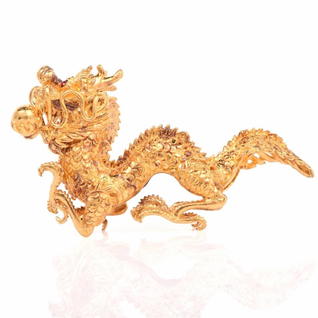 This 24k pure Chinese dragon gold figurine has an outstanding handmade work design showing off all its gorgeous details. Accenting the dragon’s eyes, there are 2 genuine round cut garnet approx: 0.03cttw, bezel set. this dragon figurine is in