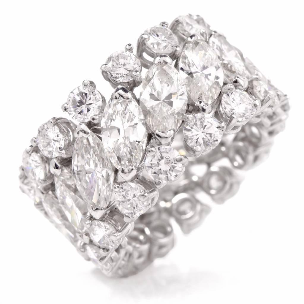 This breathtaking Platinum eternity band ring is adorned with 15 genuine high quality marquise cut Diamonds approx: 7.80cttw, I-J color, VS1-VS2 clarity, prong set and with 30 genuine round brilliant cut Diamonds approx: 3.90cttw, H-I color, VS1-VS2