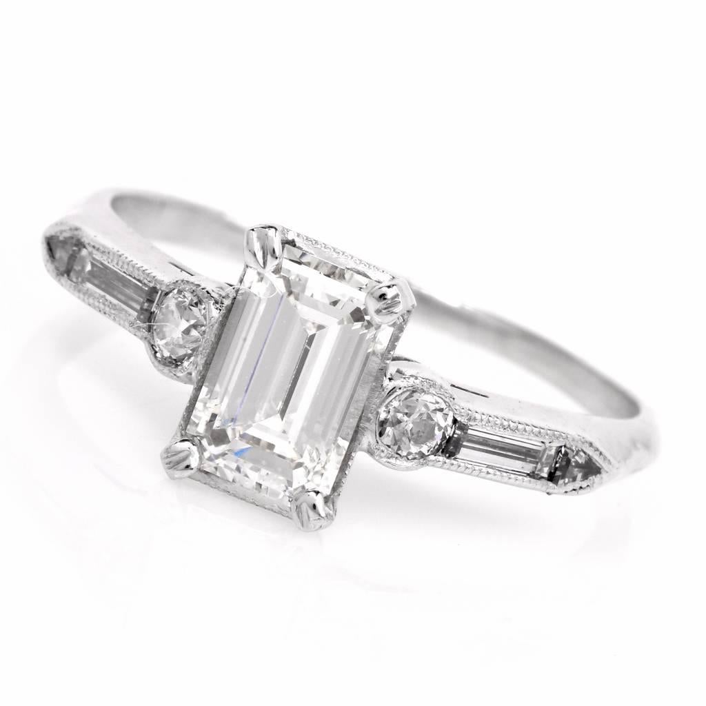 This 1960’s vinatge diamond engagement ring is crafted in solid platinum. This ring is centered with a  genuine emerald-cut  diamond of approx 1.00ct, graded G-H color, VS1 clarity and accented with 2 genuine baguette diamonds, 2 round European-cut