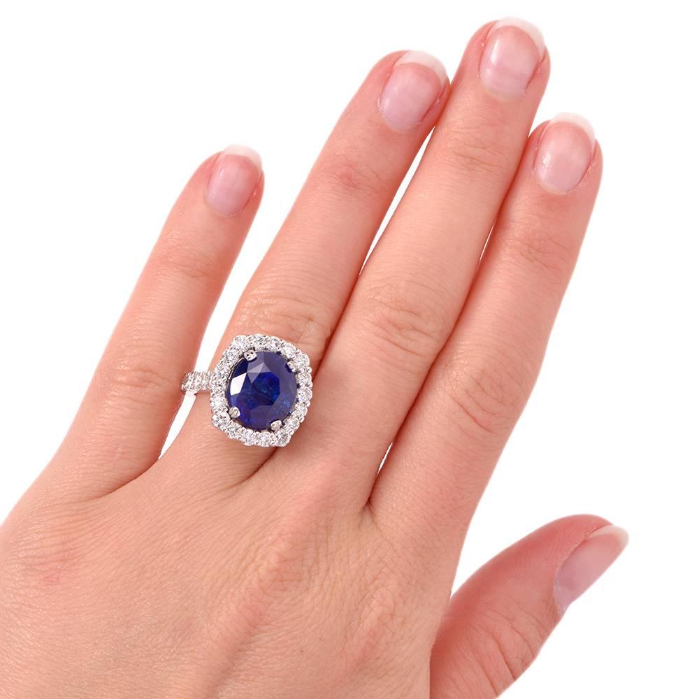 This stunning 18K white gold ring is centered with 1 genuine oval cut vivid blue Ceylon Sapphire certified by GRS Swiss Lab Report No. 070023, weighing approx: 10.47 carats, prong set. This fabulous natural corundum is surrounded with 18 genuine