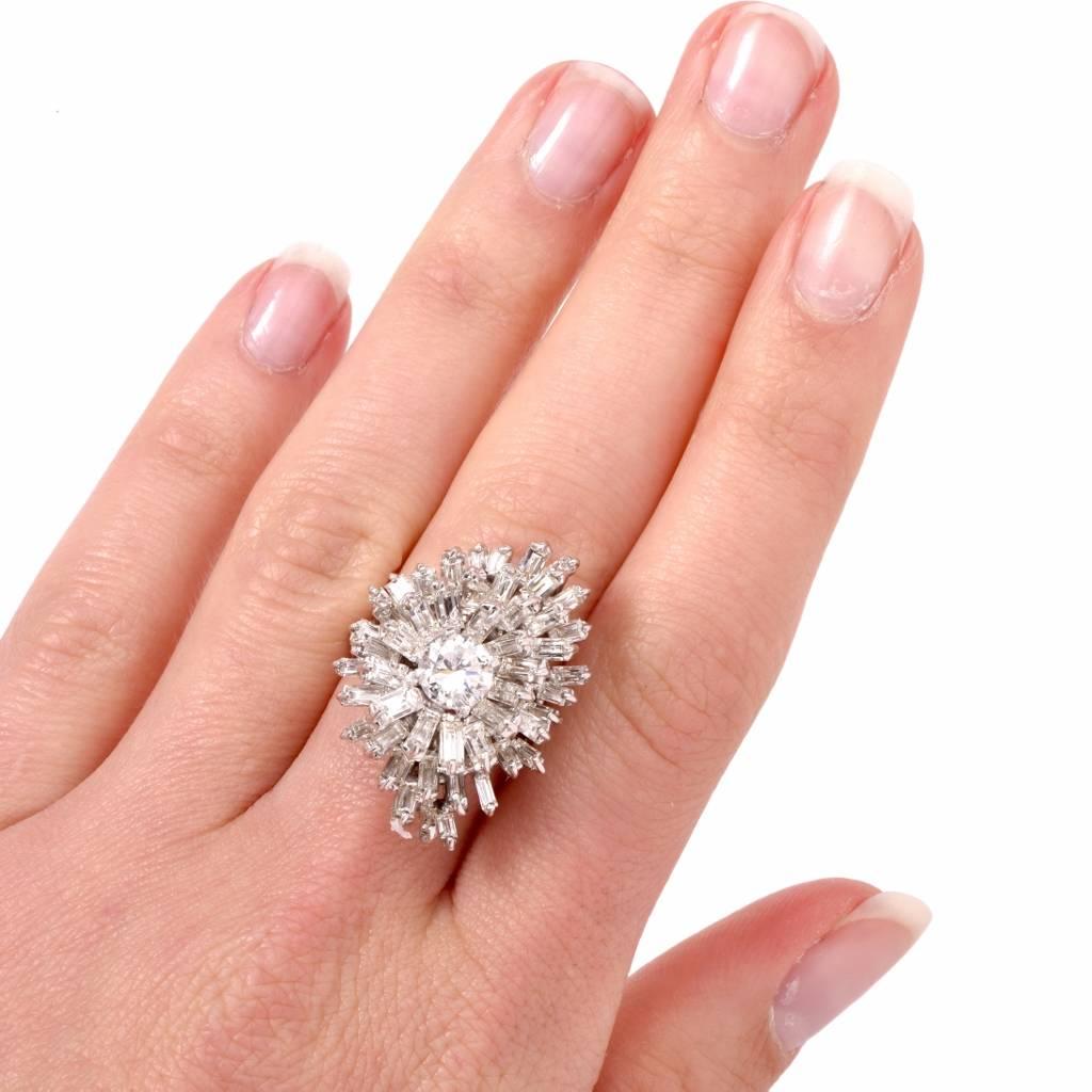 This stunning estate diamond cluster cocktail ring is crafted in solid 18K white gold. This sparkling diamond ring is centered with 1 genuine round cut Diamond approx: 1.05cttw, H-I color, SI1 clarity, prong set. The center stone is surrounded by a