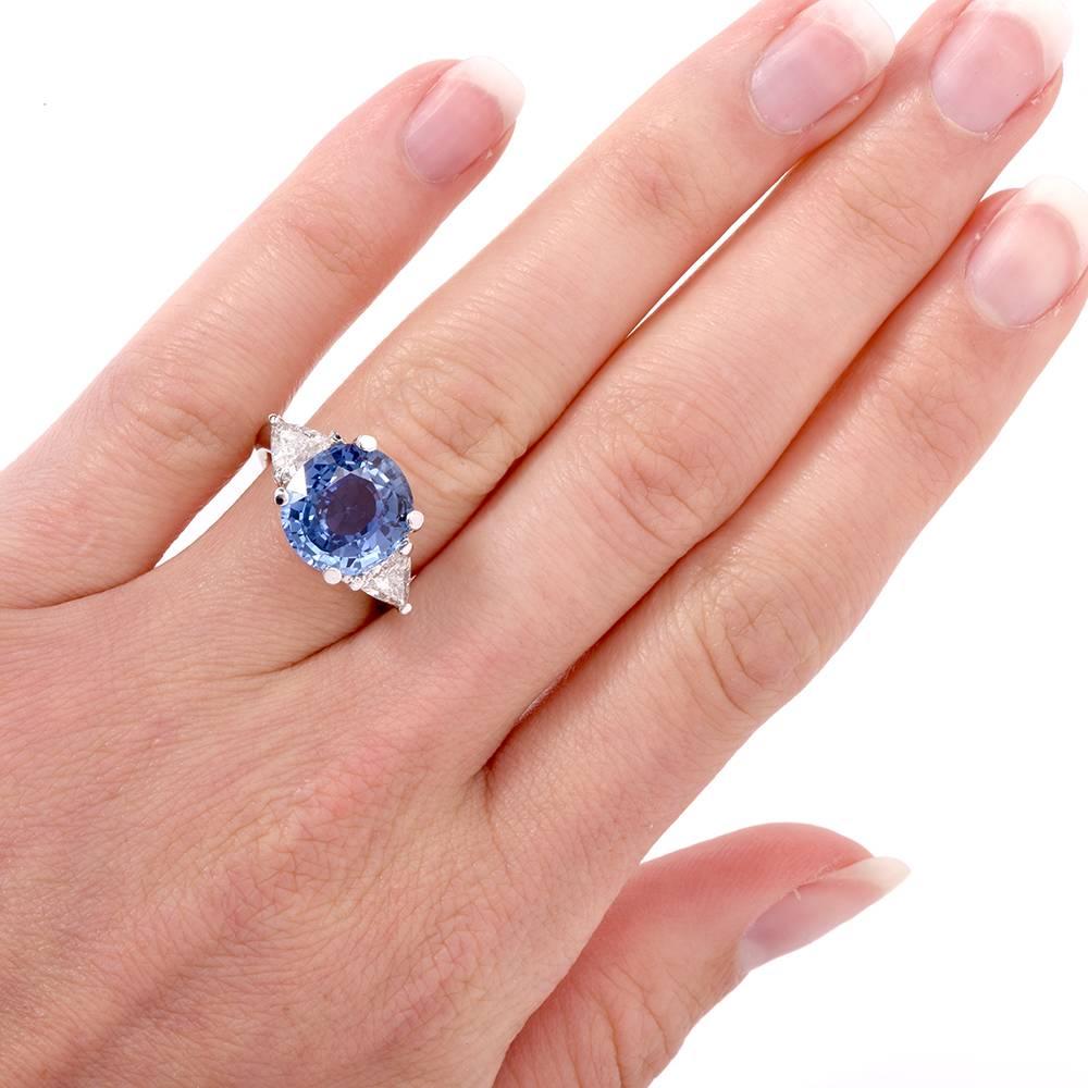 This sparkling Sapphire diamond ring is crafted in solid platinum. It exposes at the center a natural corundum heated sapphire of sky blue color with high transparency, measuring 11.82 x 11.11 x 6.30mm with GIA certificate, weighing approx. 6.05cts.